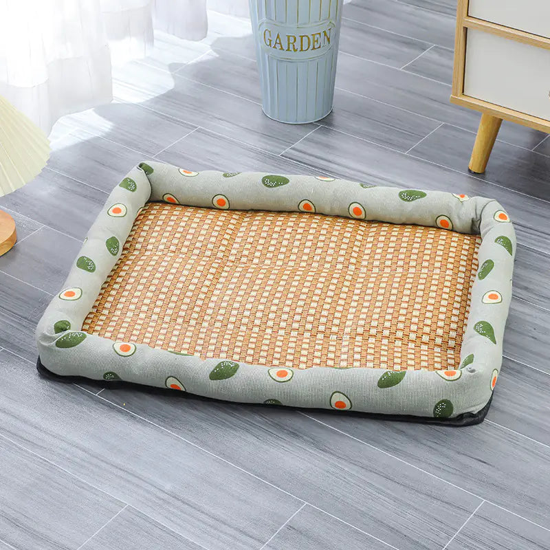 Rectangular pet cooling mat with a green border and a beige center, on the floor creating a dog chill spot.