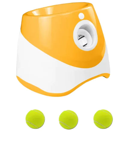 Orange and white tennis ball launcher with three yellow tennis balls for puppy play time